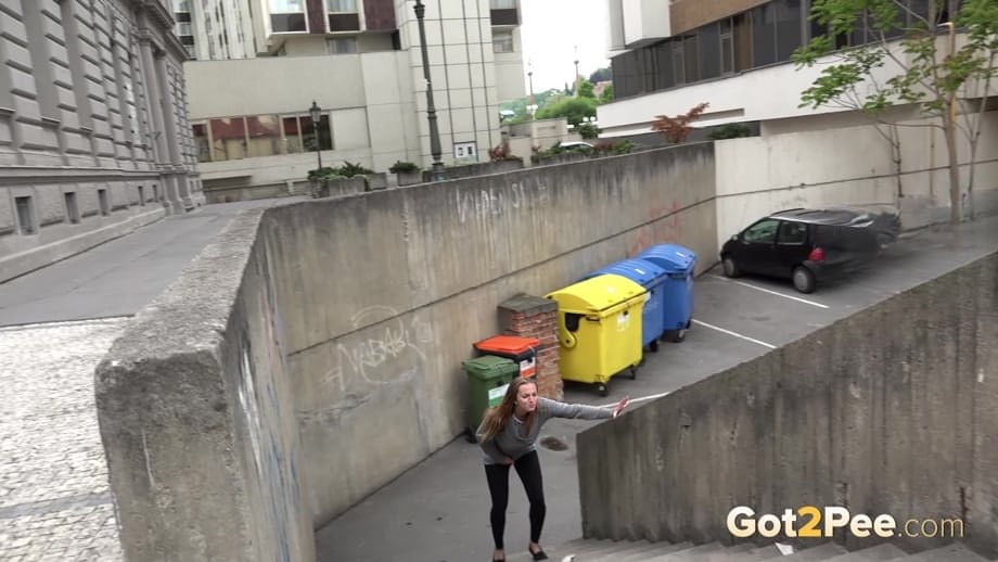 Blonde teen Suzzie baring her pussy lips and sexy ass and pissing in public