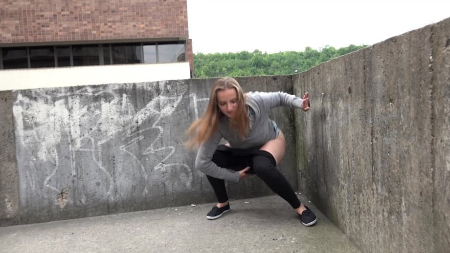 Blonde teen Suzzie baring her pussy lips and sexy ass and pissing in public