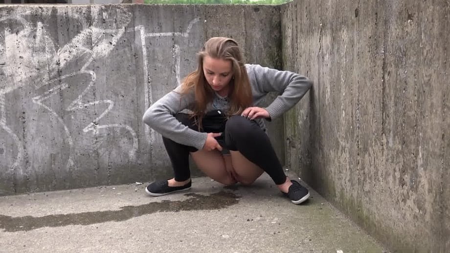 Blonde teen Suzzie baring her pussy lips and sexy ass and pissing in public