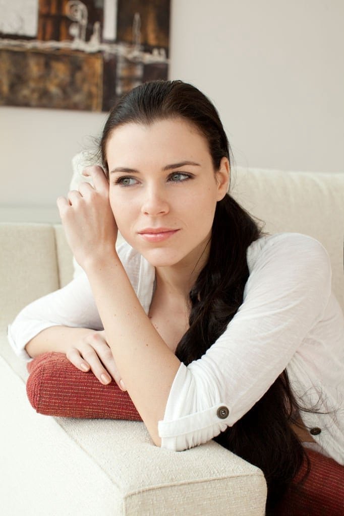 Pretty brunette with gorgeous face Valeria A lounging on sofa in the nude