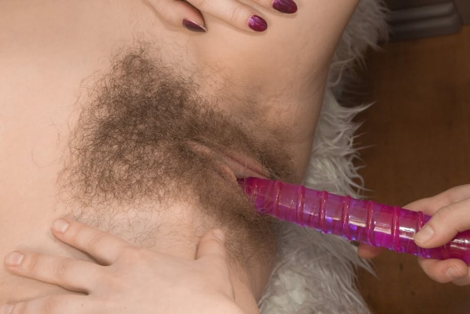 Young beauty Miranda takes part in a hairy lesbian bedroom tribbing romp