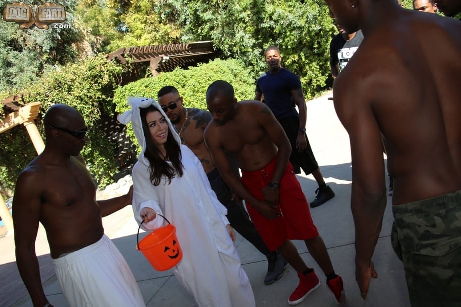 White slut Melissa Moore sucks off a group of big black cocks