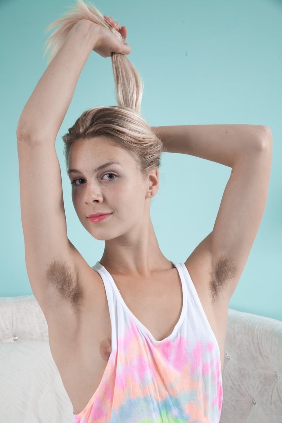 Amateur model Alecia Fox proudly shows off her hairy pits and pussy on her bed