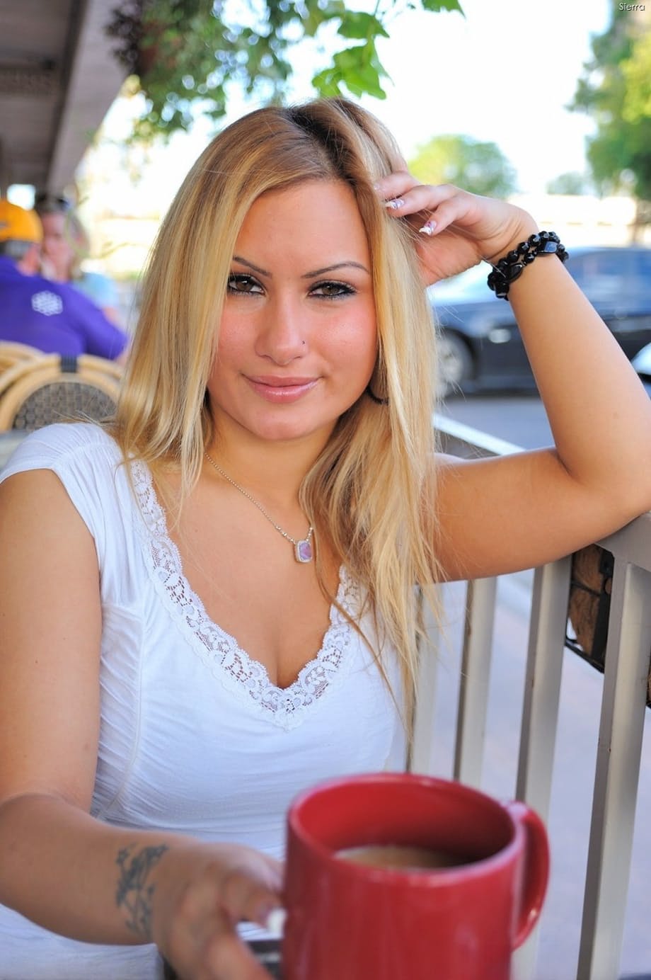 Attractive Sierra displays her exotic pierced pussy and big tits outdoors