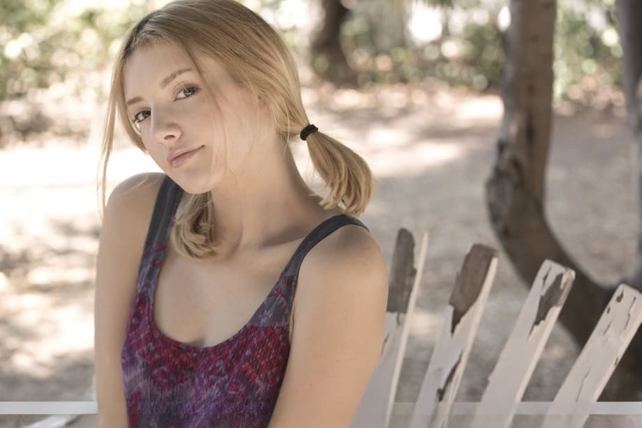 Teen first timer Lena Anderson vaunts her lithe body under a tree outside