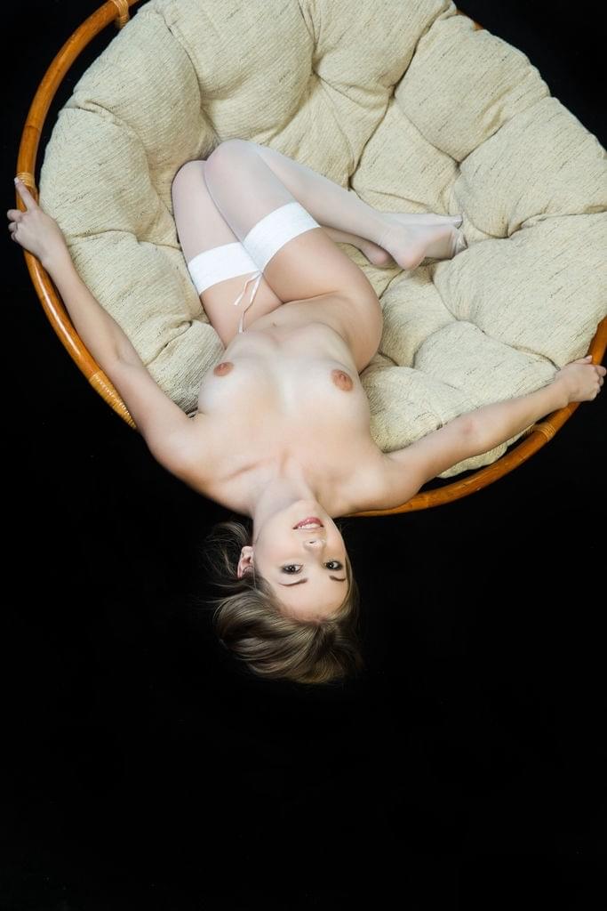 Beautiful teen girl Jeff Milton modeling sexily in white stockings only