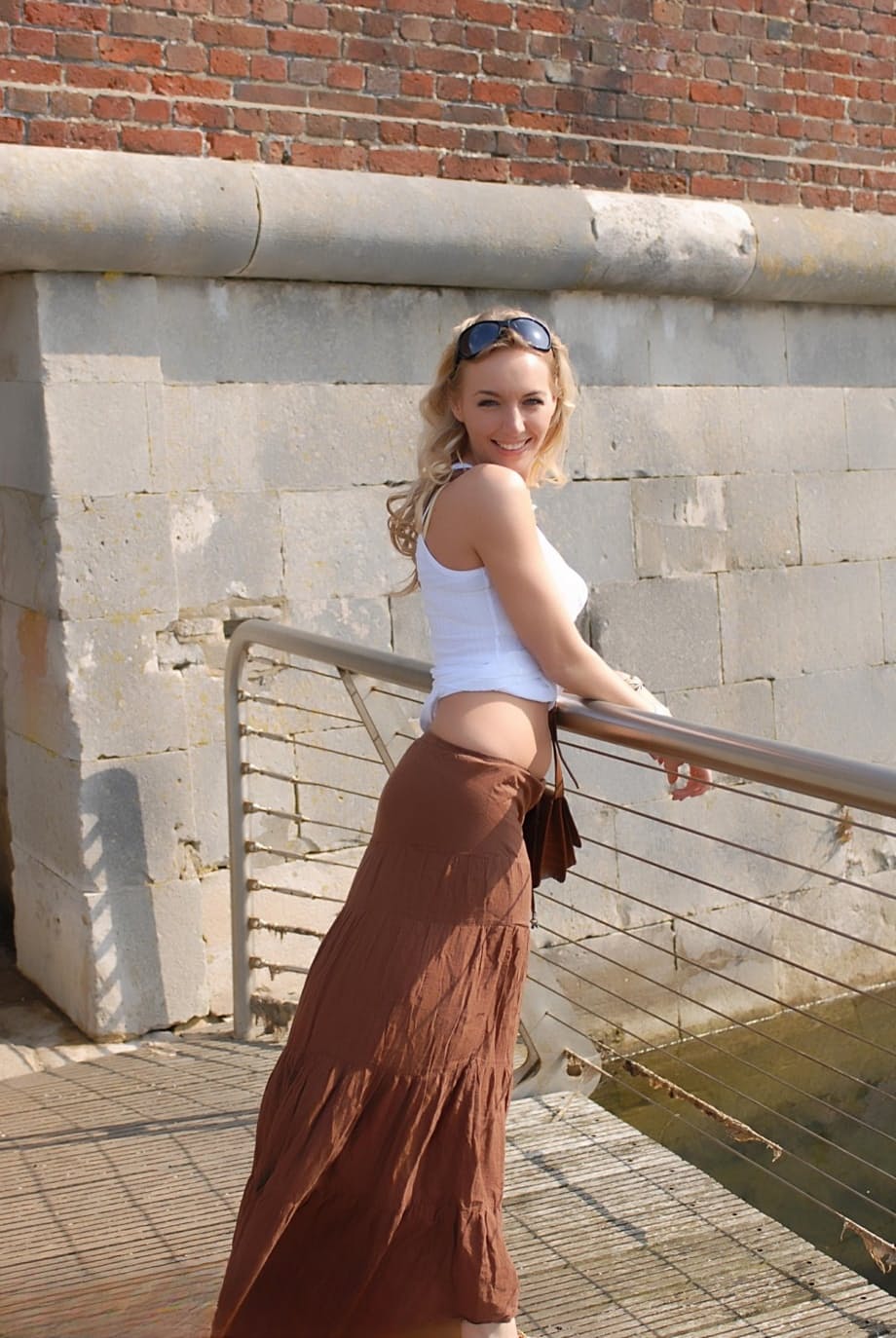 Solo girl Hayley Marie Coppin flashes her bare ass while walking on sidewalk