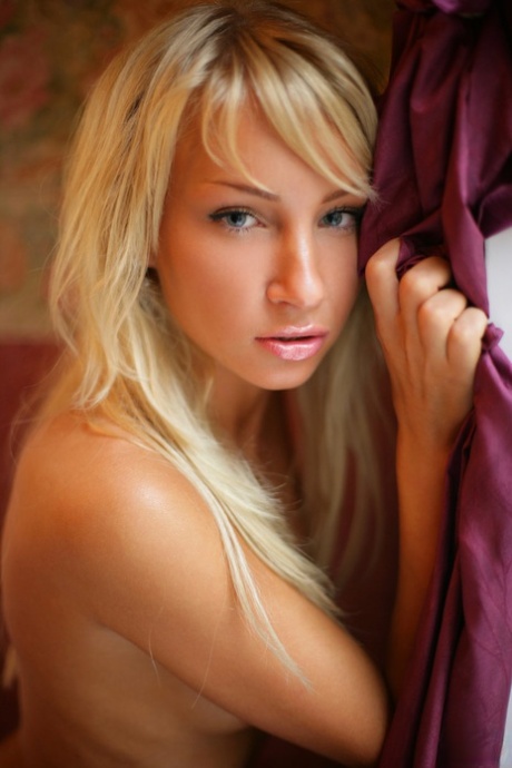 Lovely golden haired Dasha shows her sexy naked skinny body