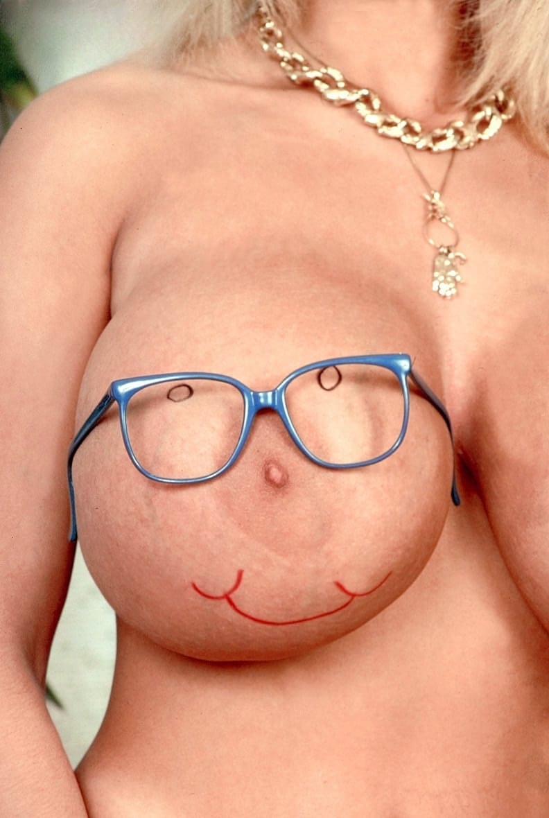 Mature MILF Tiffany Towers takes off her glasses before uncupping giant boobs