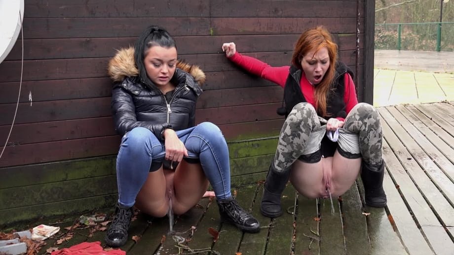 Naughty chick Sandra and her best friend pull down their pants and pee outside