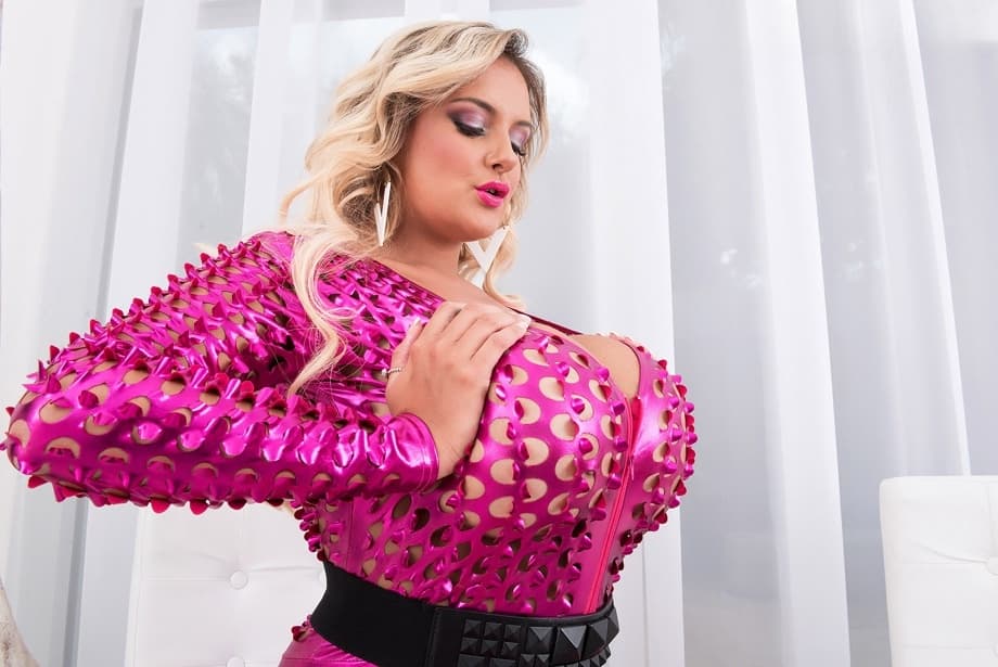 Blonde bomber Katie Thornton frees her hooters from mesh funky bodystocking
