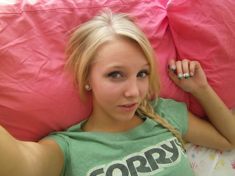 Cute blonde teen snaps self shots of her bare boobs in cutoff jean shorts