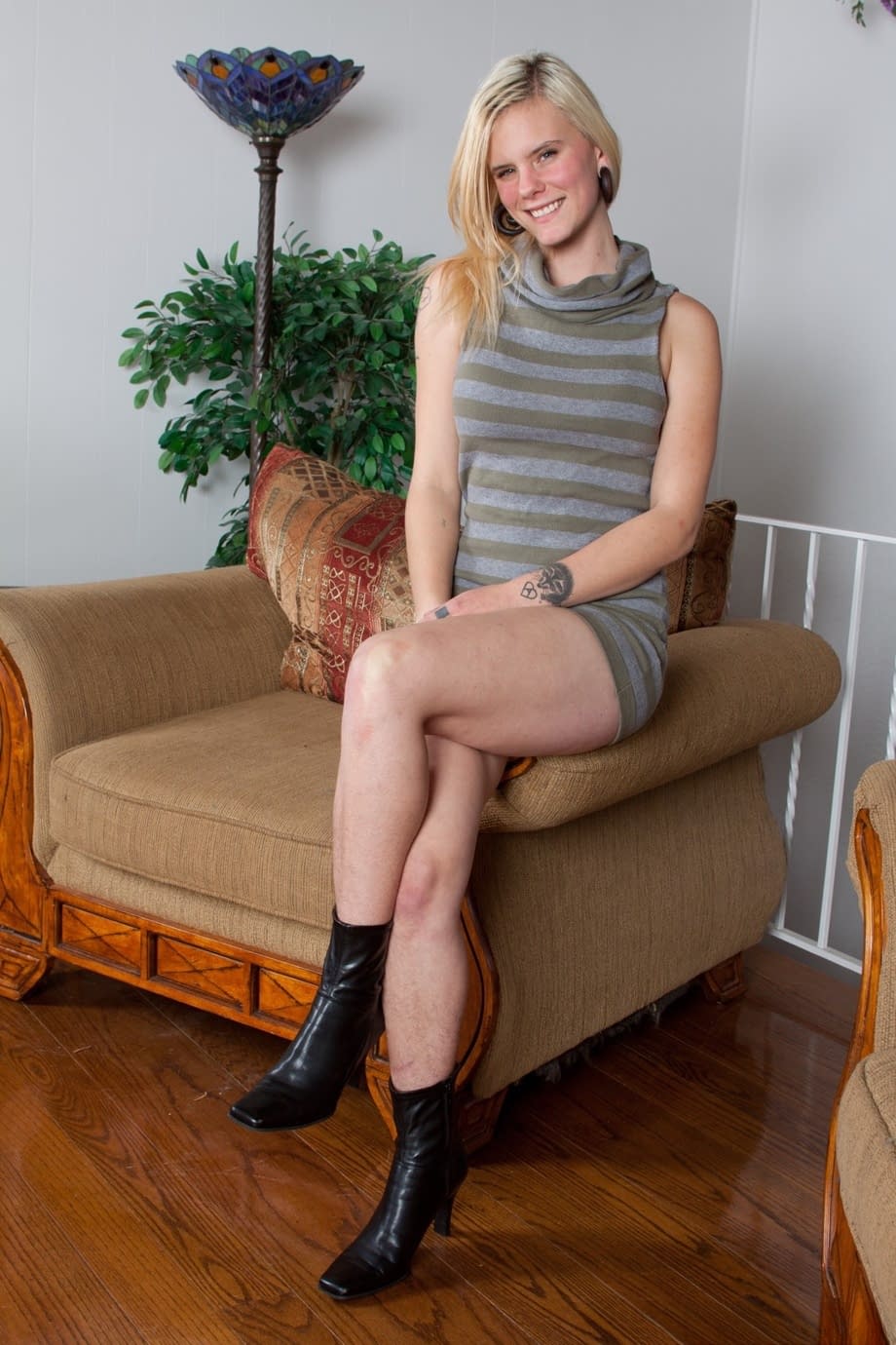 All natural blonde undresses and parts her hairy pussy lips on chair