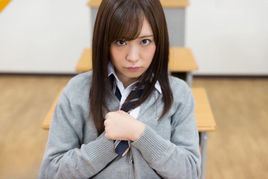 Japanese schoolgirl pulls down her cotton underwear during upskirt action