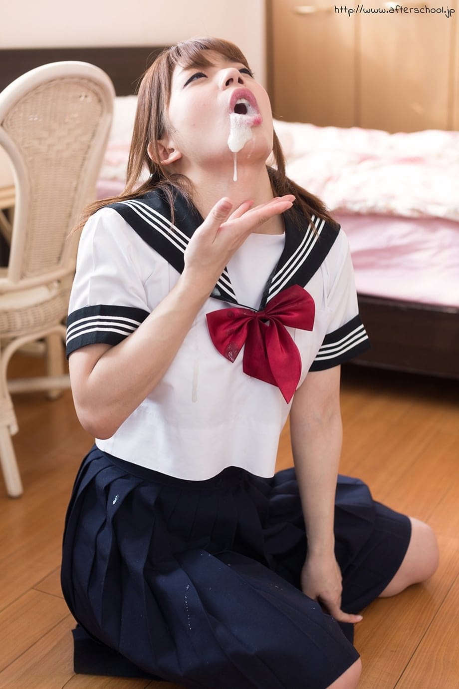 Japanese schoolgirl spits out cum after sucking off two cocks