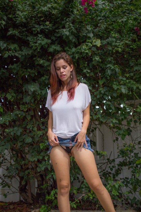 First timer Marina Rossi reveals her big naturals and juicy ass in the yard