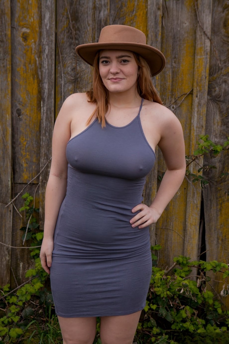Sexy clothed Dallin Thorn lifts her tight dress to show her plump round ass