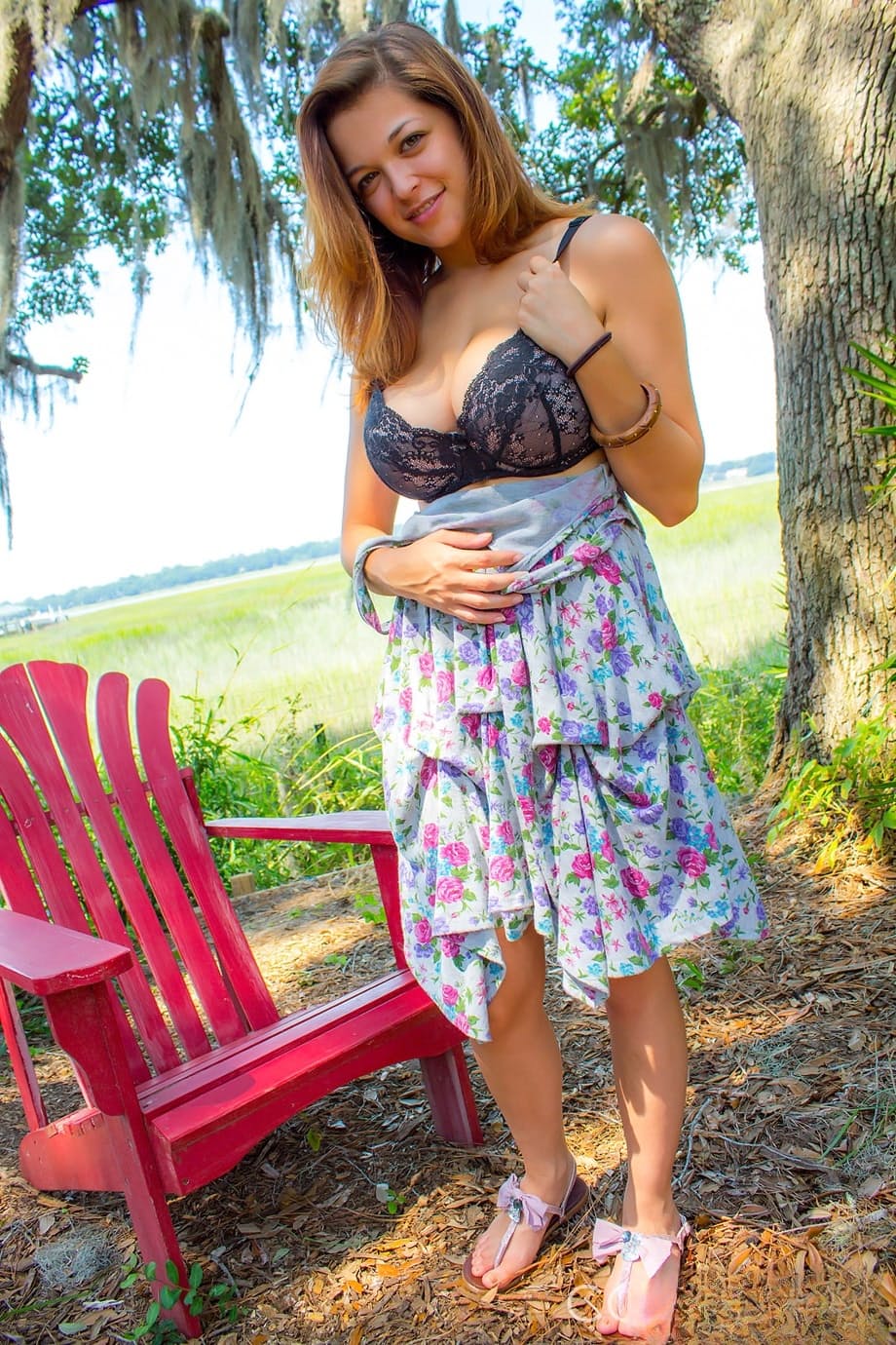Hot amateur Tessa Fowler disrobing outdoors to tan her big tits in the yard
