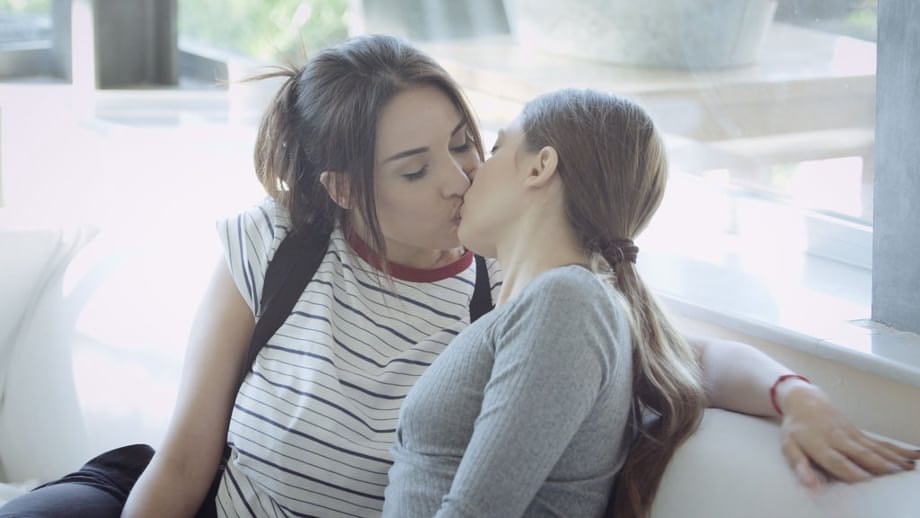 Lesbian women Talia Mint & Anissa Kate kiss before licking pussy on bed