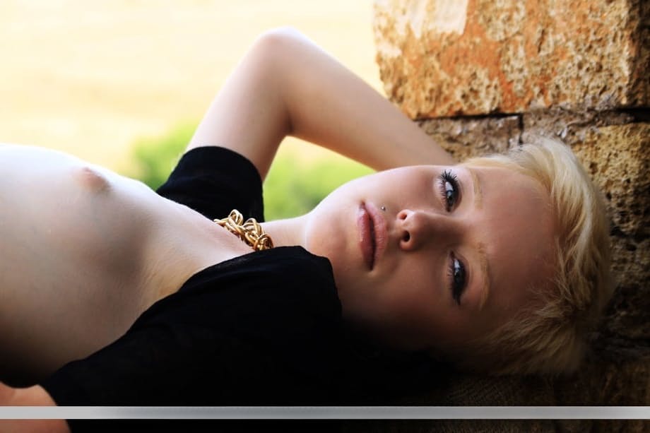 Slender teen Spirit displays her very tiny tits posing nude in an old castle