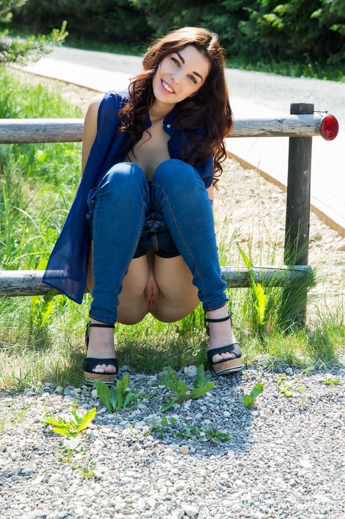 Brunette teen Evita Lima shows off her big natural tits on the road