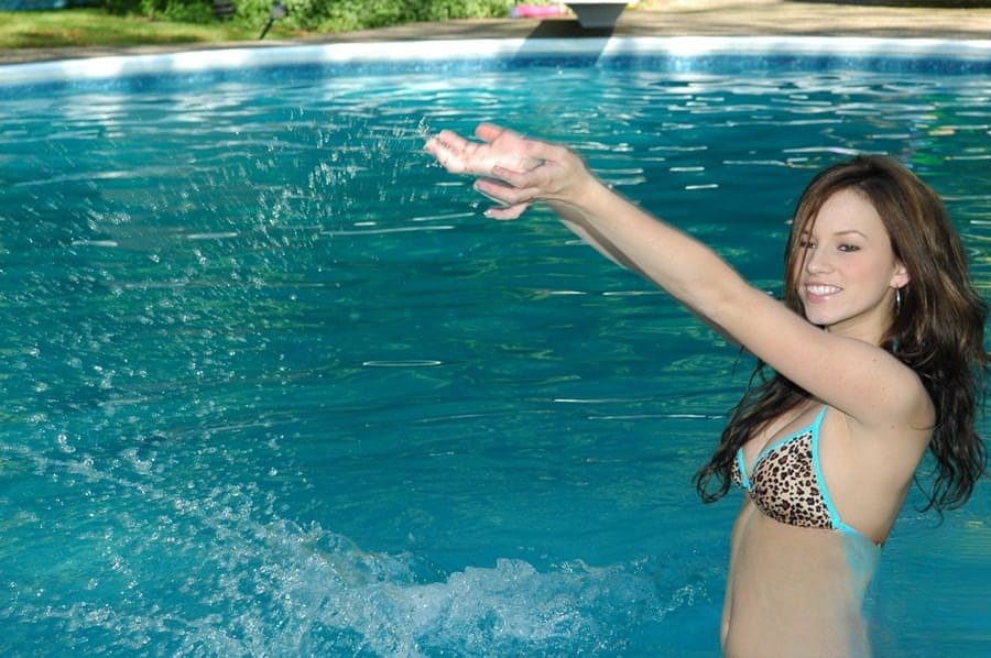 Teen first timer models non nude in a string bikini out in the pool