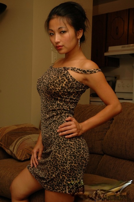 Sexy Asian amateur Aria Lee hikes her skin tight dress to display her firm ass