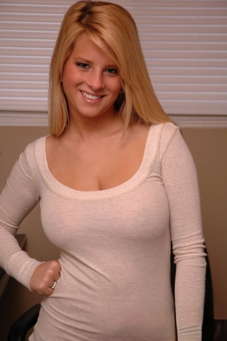 Office assistant Kimmy strips & spreads legs showing big tits & shaved beaver