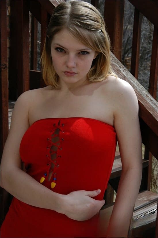 Young white girl Danielle reveals black upskirt panties outdoors