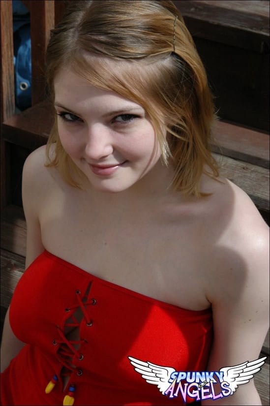 Young white girl Danielle reveals black upskirt panties outdoors