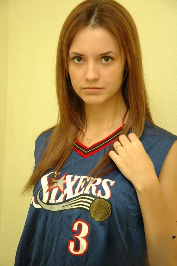 Young cheerleader Amy lifts her uniform to tease with sexy panties & underboob