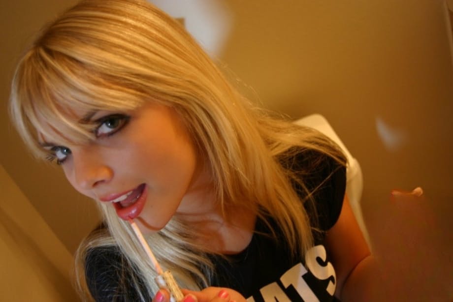Cute blonde chick Jana Jordan strips to her underwear in the bathroom