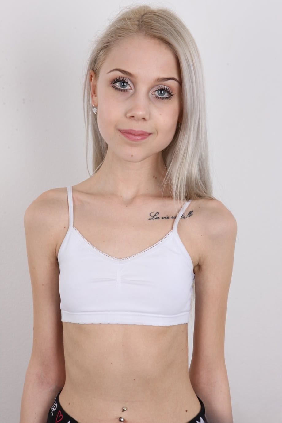 Skinny 18 year old virgin Natalia takes off her clothes to stand in the nude
