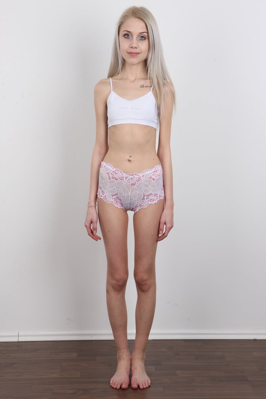 Skinny 18 year old virgin Natalia takes off her clothes to stand in the nude