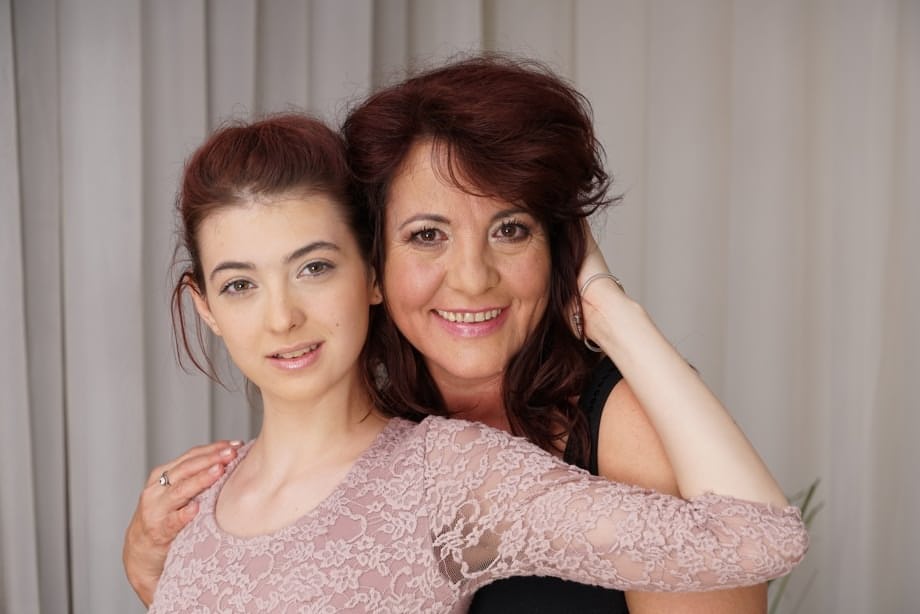 Older and younger lesbians kiss before undressing for oral sex exchange
