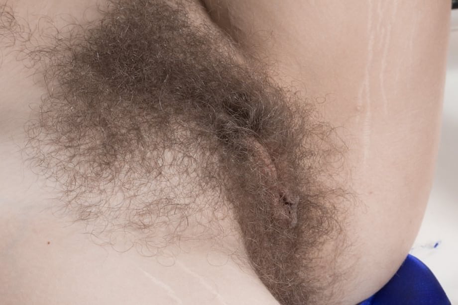 Amateur model Pixxy spreads her legs in bathroom to exhibit her hairy vagina