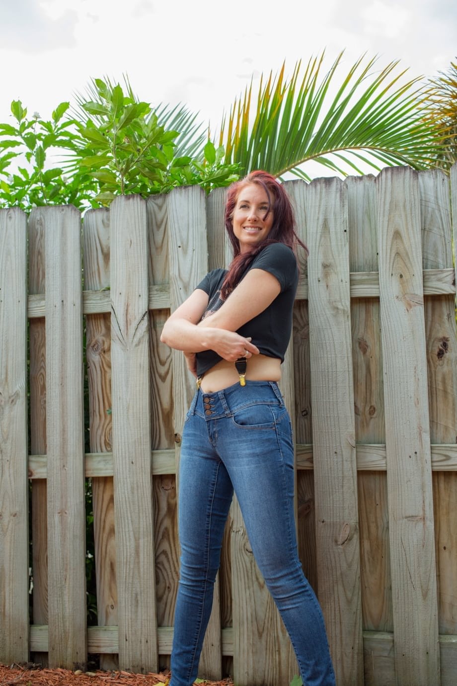 Hot redhead Andy Adams loses her t-shirt & jeans in the yard to pose naked