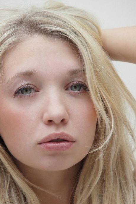 Blonde girl from Slovakia models in the nude wearing black heels