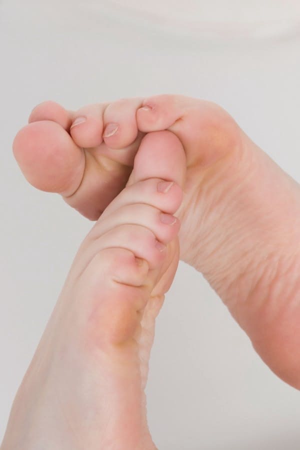 Hot redhead Jenny Smith naked and showing her sexy bare feet close up