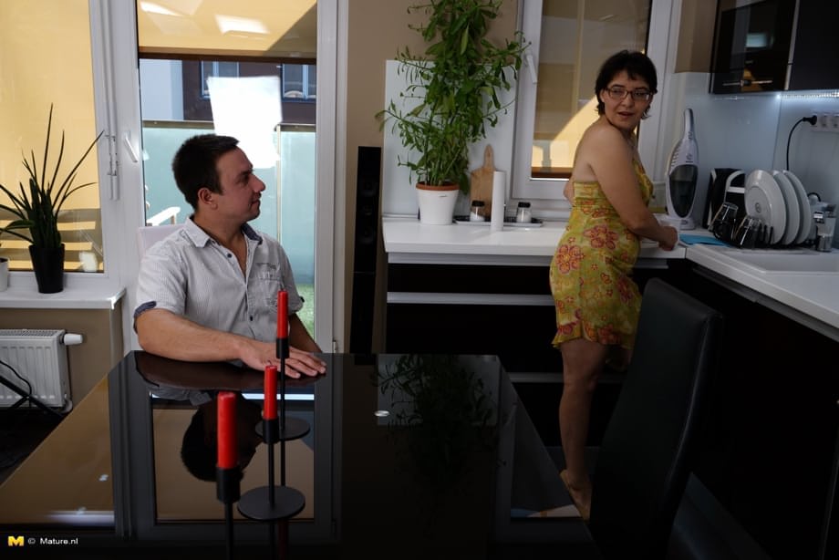 Older granny kissing and petting her toy boy and fucking in the kitchen