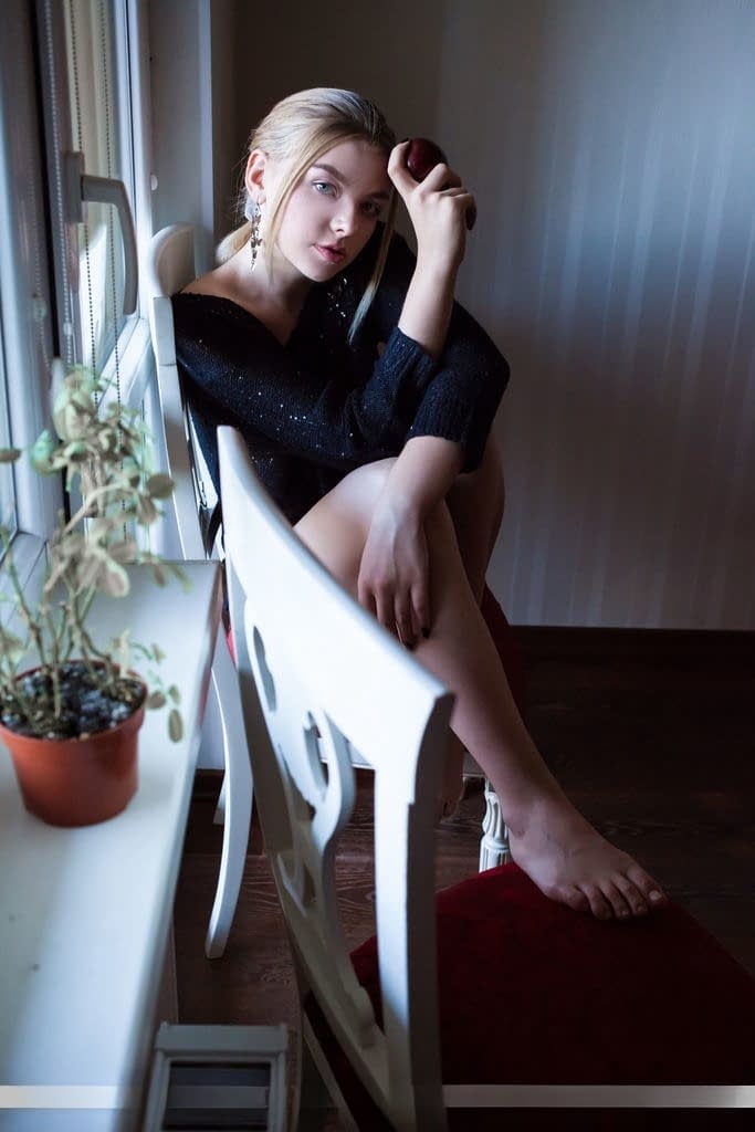 Erotic young Daniel Sea strips at her desk to spread her long legs wide open