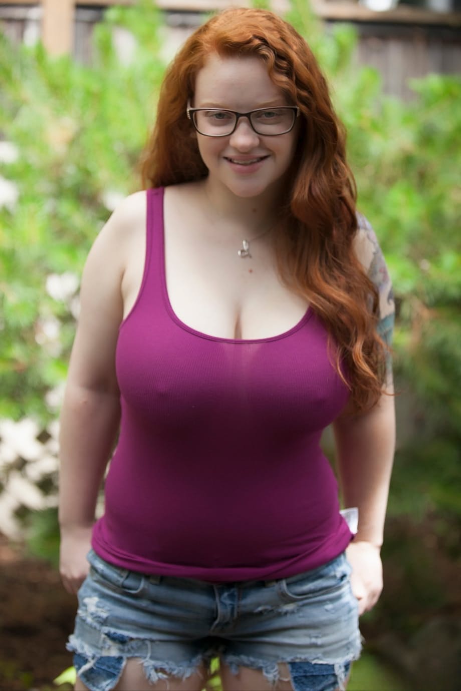 Natural redhead teen exposes her thick body and big saggy boobs in the woods