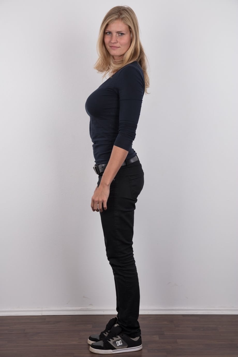 Pretty blonde Adriana strips off her jeans to show her big saggy boobs