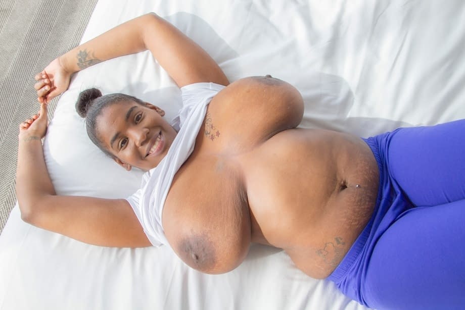 Thick black chick unleashes her huge saggy boobs in her underwear