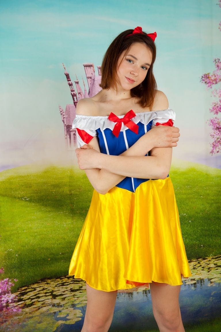 Cute teen cosplay girl Slava strips her costume to spread with bare feet
