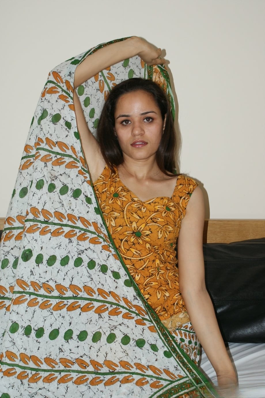 Small titted young Indian girl undressing slowly to lounge naked on her bed