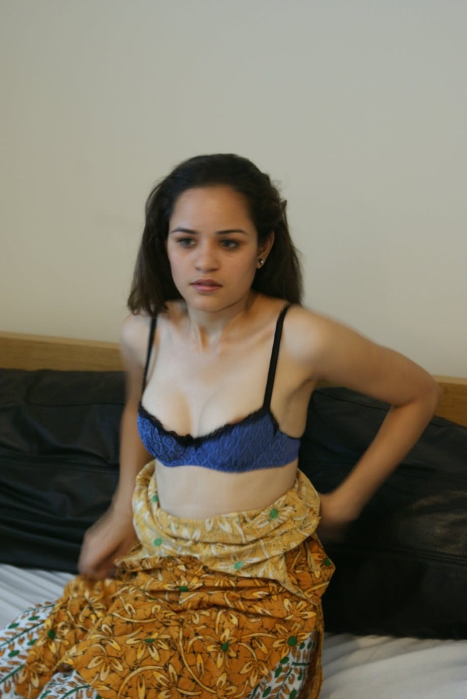 Small titted young Indian girl undressing slowly to lounge naked on her bed