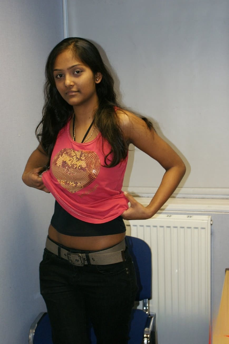 Desi solo girl holds her nice tits as she undresses to model in the nude