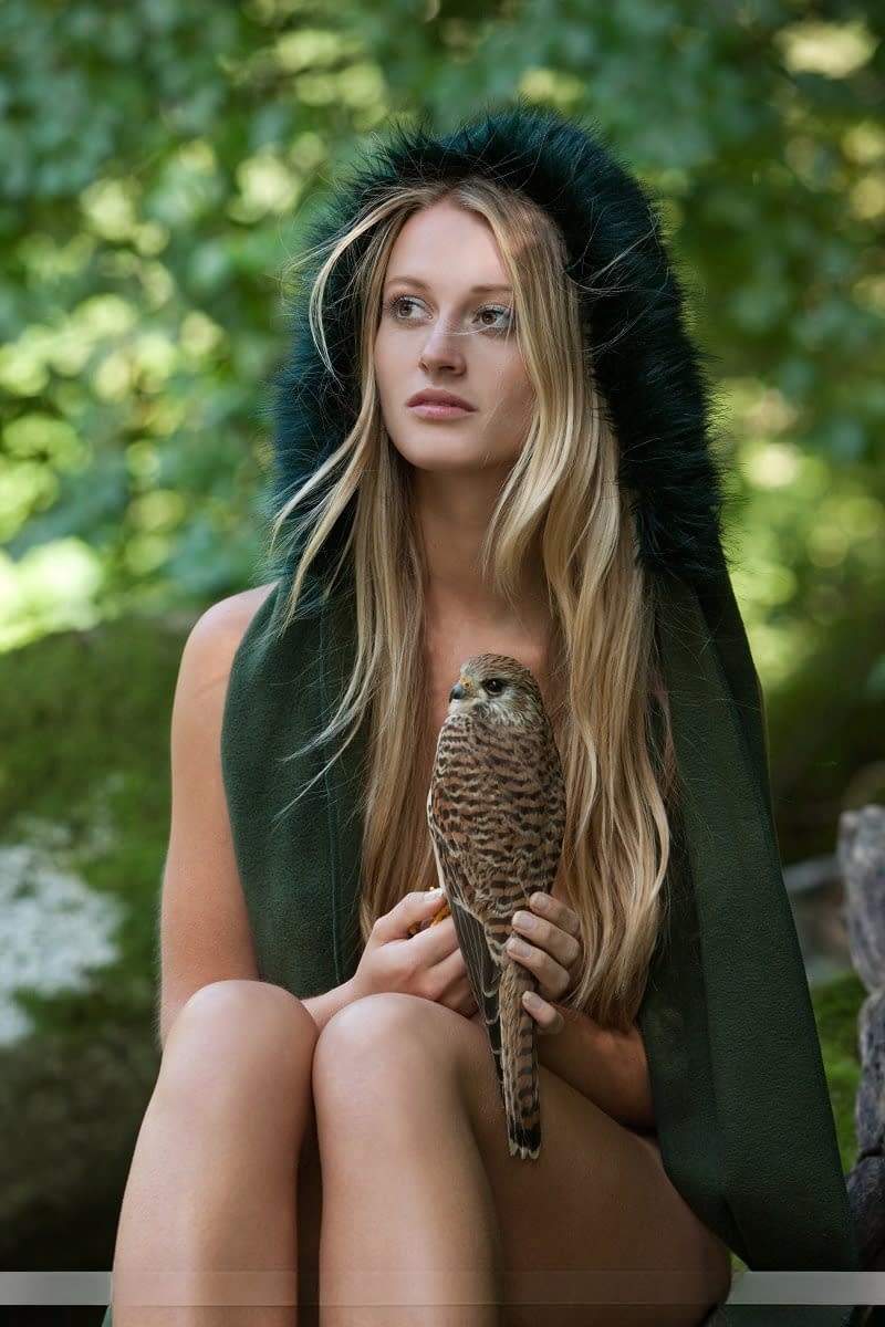 Sexy blonde with nice tits and ass goes hunting in the nude with her Hawk