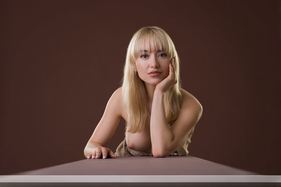 Big titted blonde beauty Lia poses seductively nude showcasing perfect breasts